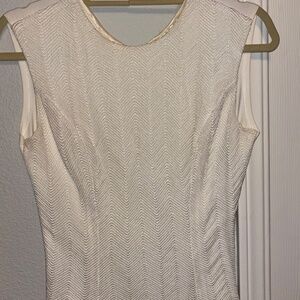 Elegant embroidered sleeveless tops in beige, white, blue/white and black